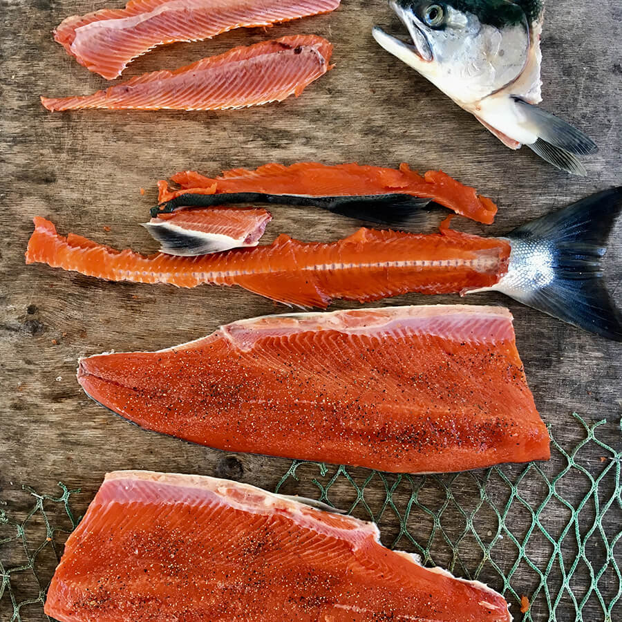 Wild Salmon filleted and broken down to prepare for cooking