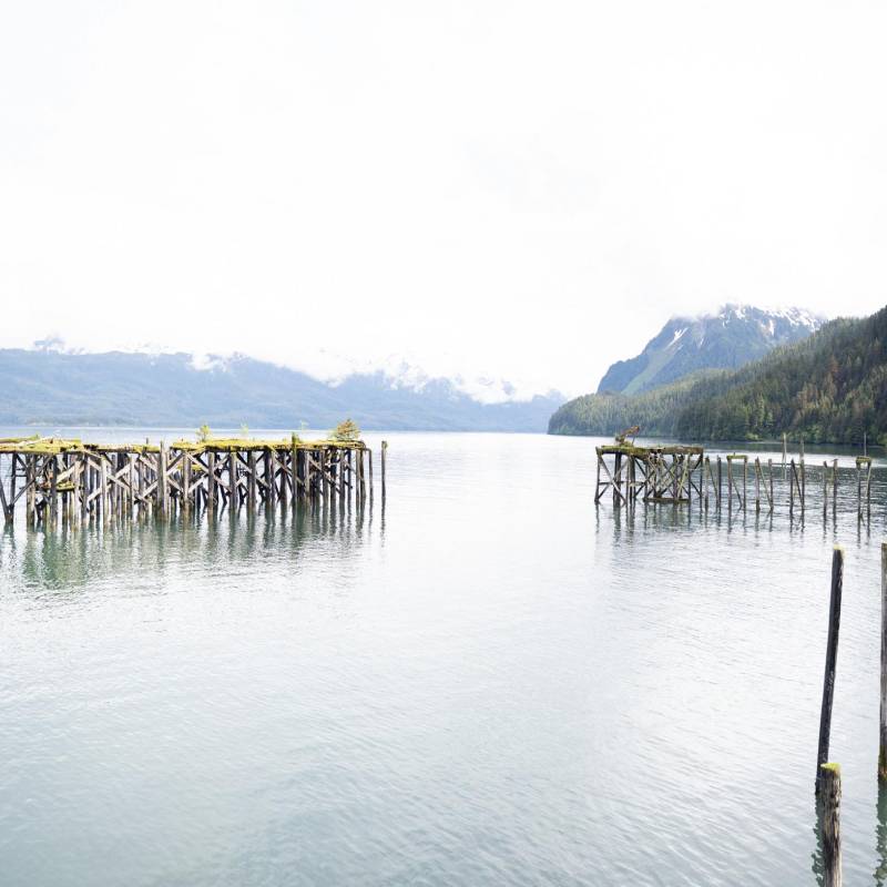 Alaska fisherman collecting net by boat