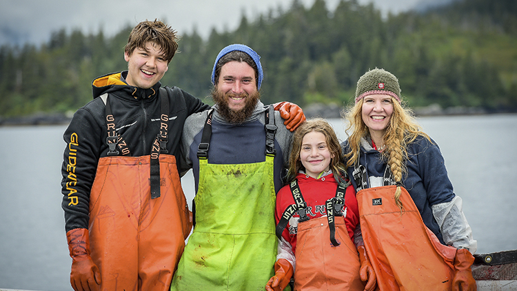 Fisherman and family on water in Alaska